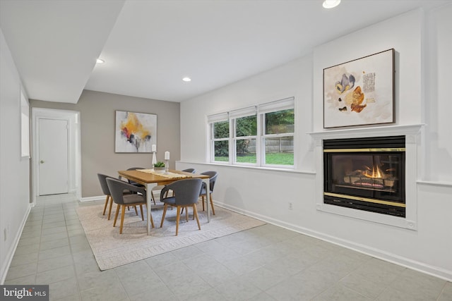 1220 Wendover Rd, Bryn Mawr, PA 19010 - dining space featuring recessed lighting, light tile patterned floors, baseboards, and a glass covered fireplace