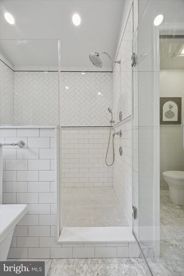 1220 Wendover Rd, Bryn Mawr, PA 19010 - bathroom featuring a stall shower, tile walls, and toilet