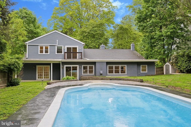 1220 Wendover Rd, Bryn Mawr, PA 19010 - back of house featuring an outdoor structure, a lawn, a storage unit, and a balcony