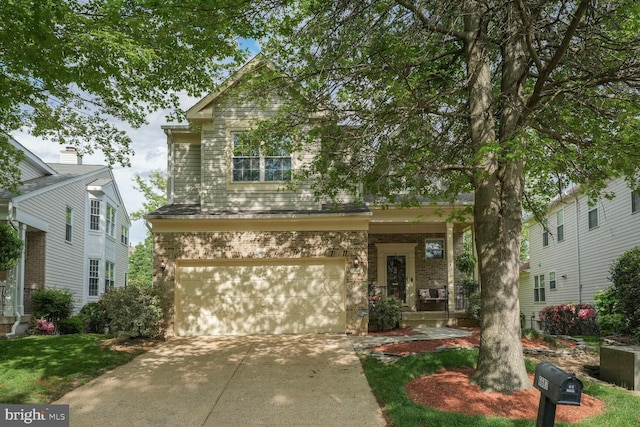 view of front of property featuring a garage and concrete driveway