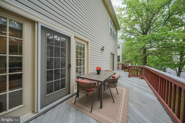 deck featuring outdoor dining area