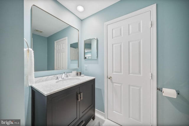 bathroom with visible vents and vanity