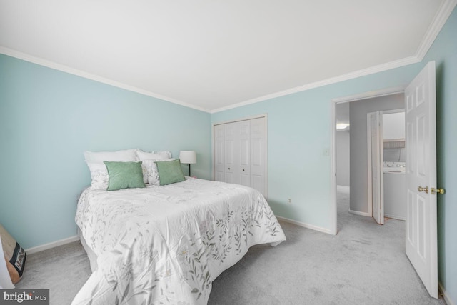 carpeted bedroom featuring crown molding, baseboards, and a closet