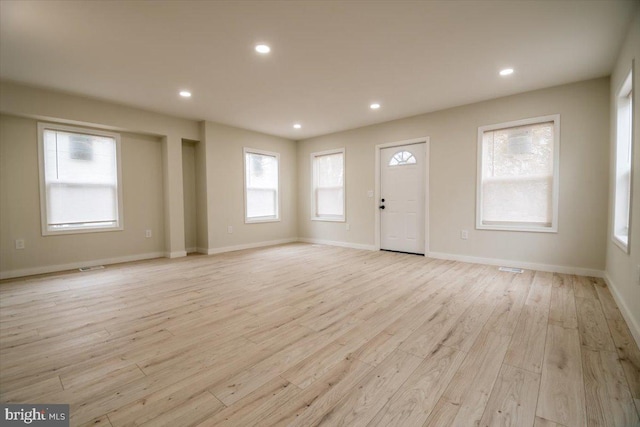 foyer entrance featuring recessed lighting, visible vents, and light wood-type flooring