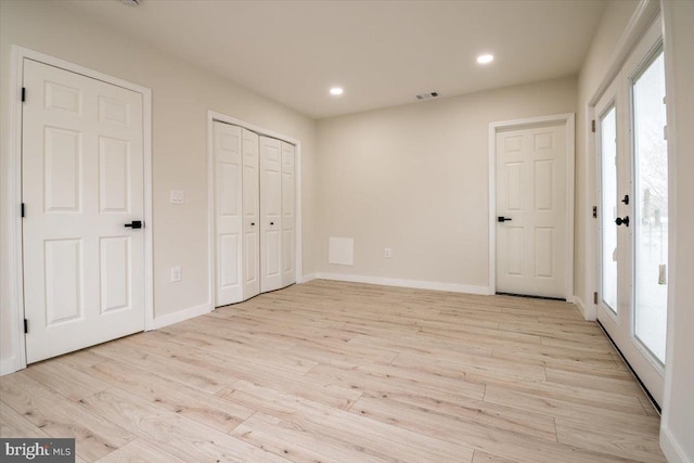 unfurnished bedroom with recessed lighting, baseboards, visible vents, and light wood-style flooring