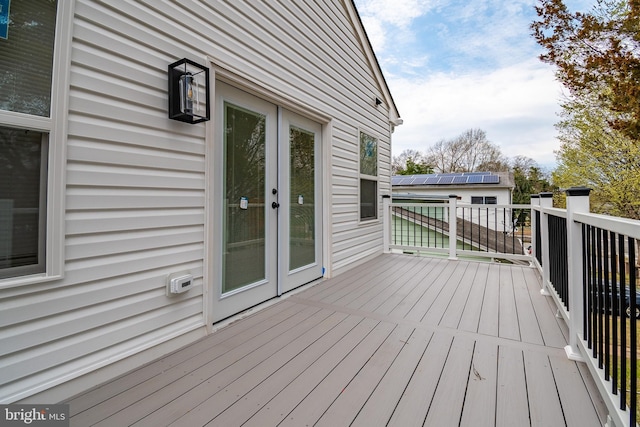 wooden deck featuring french doors