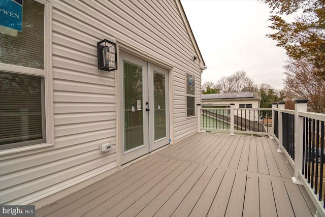 wooden terrace featuring french doors