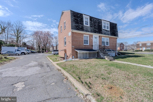 4003 25th Ave, Temple Hills, MD 20748 - colonial inspired home featuring brick siding, mansard roof, and a front yard