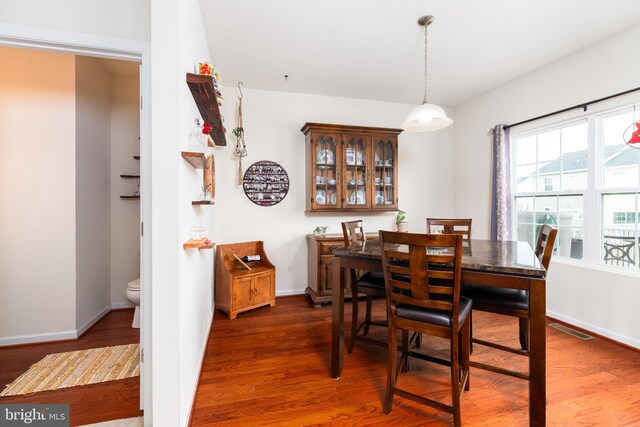 20422 Asheville Dr, Millsboro, DE 19966 - dining room featuring dark wood-type flooring, visible vents, and baseboards