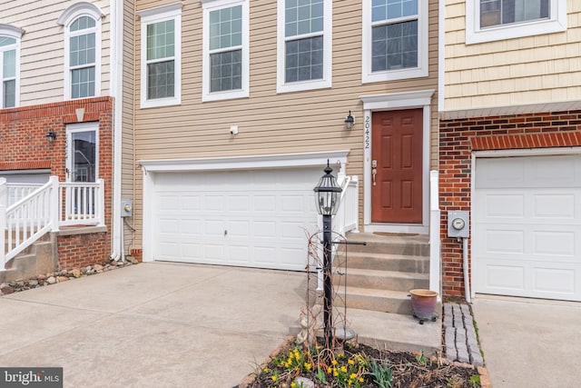20422 Asheville Dr, Millsboro, DE 19966 - entrance to property featuring brick siding, concrete driveway, and an attached garage
