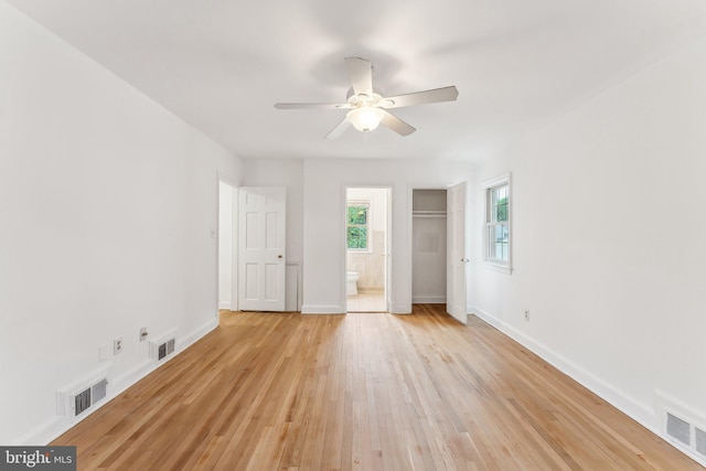 unfurnished bedroom with baseboards, visible vents, and light wood-style floors