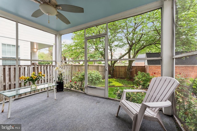 sunroom / solarium with ceiling fan and plenty of natural light