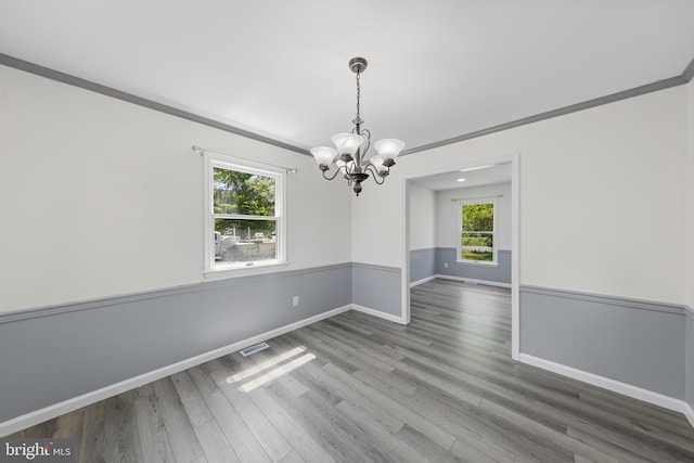 5983 Ridge Spring Cir, Salisbury, MD 21801 - spare room featuring a chandelier, baseboards, ornamental molding, and wood finished floors