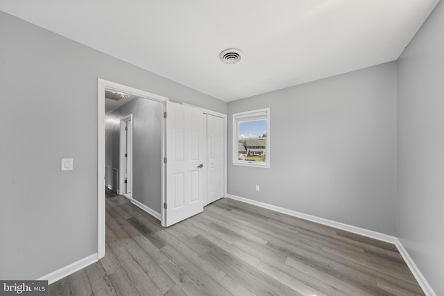 5983 Ridge Spring Cir, Salisbury, MD 21801 - unfurnished bedroom featuring wood finished floors, baseboards, and a closet