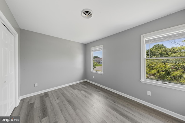 5983 Ridge Spring Cir, Salisbury, MD 21801 - unfurnished bedroom with wood finished floors, baseboards, and a closet