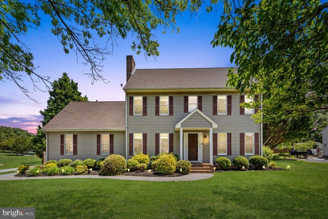 5983 Ridge Spring Cir, Salisbury, MD 21801 - colonial-style house featuring a chimney and a yard