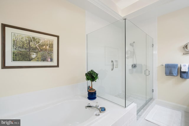 full bathroom featuring a shower stall and a bath