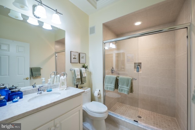 bathroom with visible vents, tile patterned flooring, a stall shower, vanity, and toilet