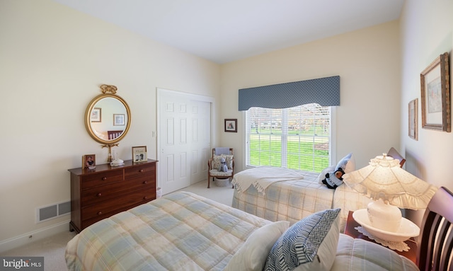 bedroom featuring carpet flooring and visible vents