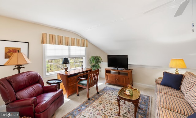 office area featuring baseboards, ceiling fan, light carpet, and lofted ceiling