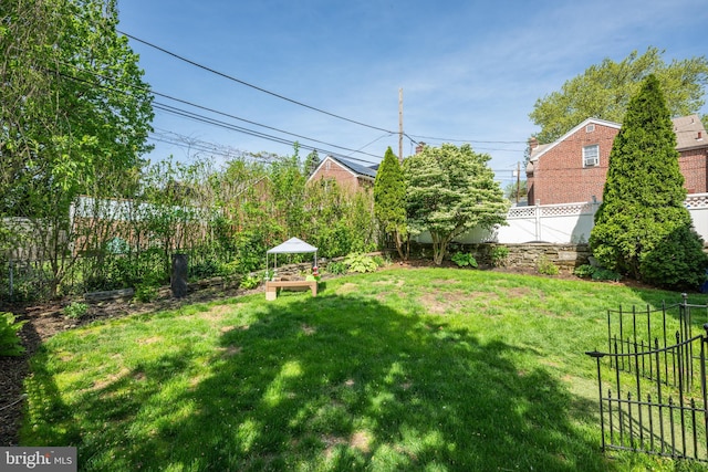view of yard with a fenced backyard