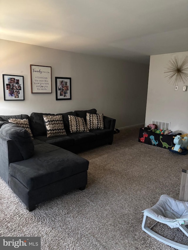 living room featuring visible vents and carpet floors