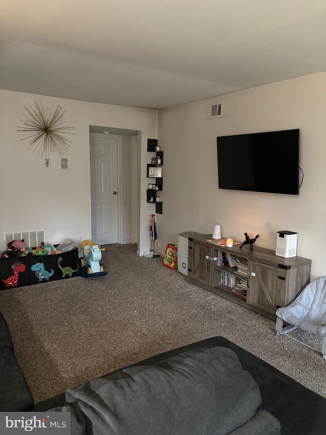 carpeted living area featuring visible vents