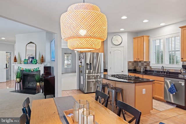 dining area featuring light tile patterned flooring, recessed lighting, and a fireplace with flush hearth