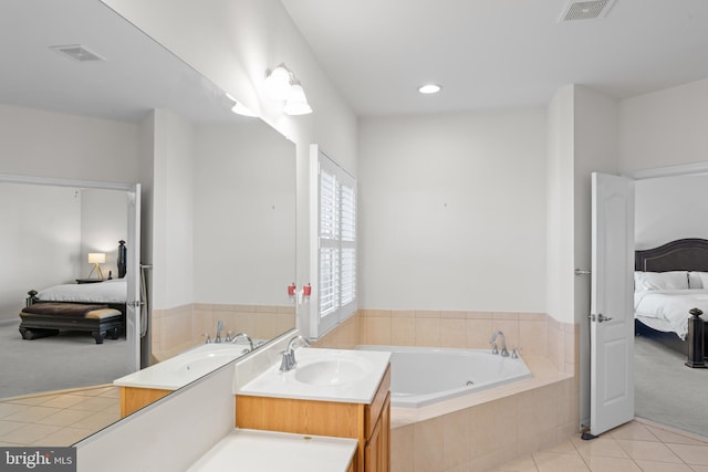ensuite bathroom featuring a sink, visible vents, and connected bathroom