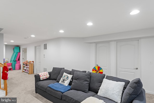 living room featuring recessed lighting, carpet, and visible vents