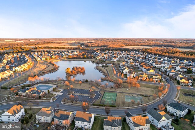 drone / aerial view featuring a residential view and a water view