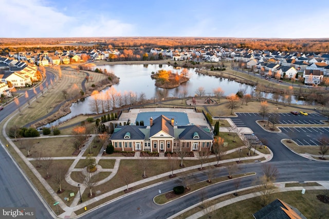 bird's eye view featuring a residential view and a water view