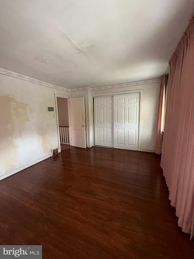 1536 E Pastorius St, Philadelphia, PA 19138 - unfurnished bedroom with wood finished floors, visible vents, and a closet