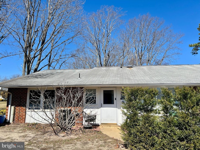 view of front of home featuring brick siding