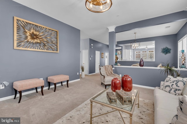 5613 Havenwood Ct, Upper Marlboro, MD 20772 - carpeted living area with baseboards, visible vents, and an inviting chandelier