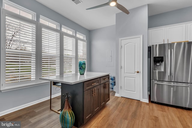 5613 Havenwood Ct, Upper Marlboro, MD 20772 - kitchen with ceiling fan, light wood-style flooring, stainless steel refrigerator with ice dispenser, and light countertops