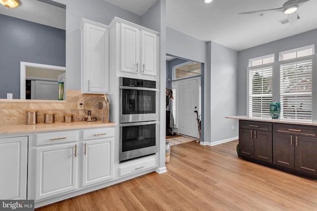 5613 Havenwood Ct, Upper Marlboro, MD 20772 - kitchen with white cabinets, light wood-style flooring, light countertops, and stainless steel double oven