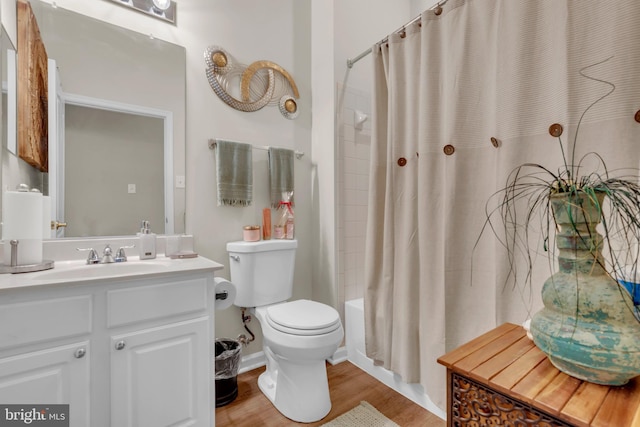 5613 Havenwood Ct, Upper Marlboro, MD 20772 - bathroom featuring toilet, vanity, shower / bath combo, and wood finished floors