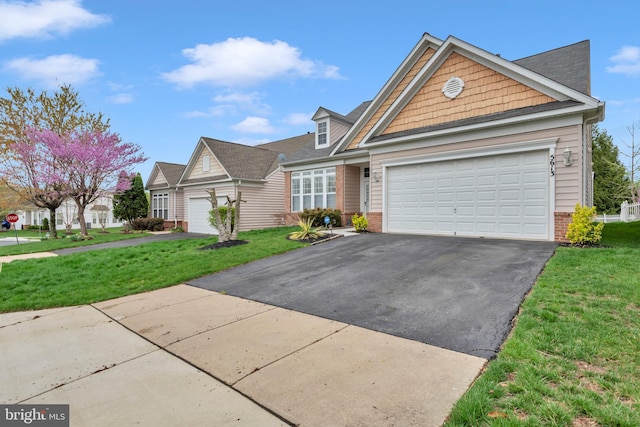 5613 Havenwood Ct, Upper Marlboro, MD 20772 - view of front of house featuring a front lawn, driveway, a garage, and brick siding