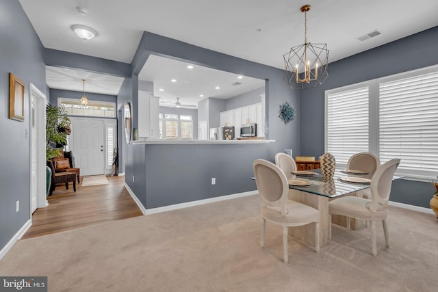 5613 Havenwood Ct, Upper Marlboro, MD 20772 - dining area featuring a chandelier, light carpet, baseboards, visible vents, and recessed lighting