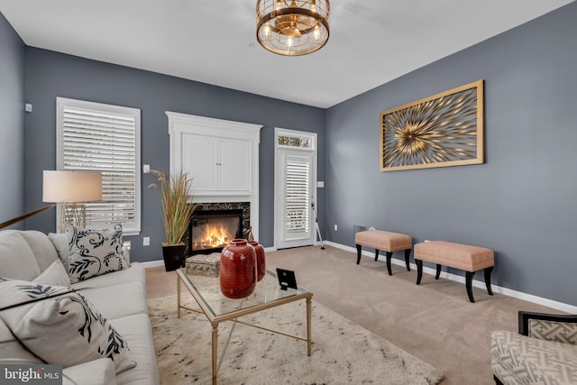 5613 Havenwood Ct, Upper Marlboro, MD 20772 - living room with baseboards, a fireplace, a chandelier, and light carpet