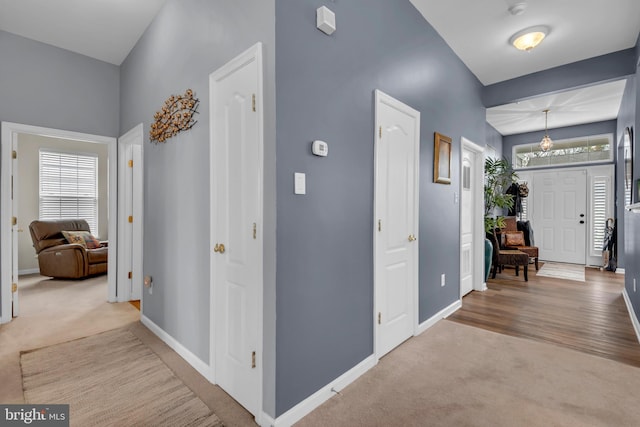 5613 Havenwood Ct, Upper Marlboro, MD 20772 - foyer with baseboards, carpet flooring, and a chandelier