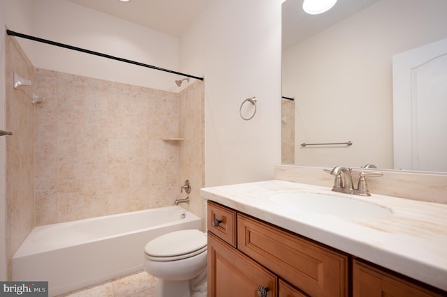 bathroom featuring toilet, vanity, and bathing tub / shower combination