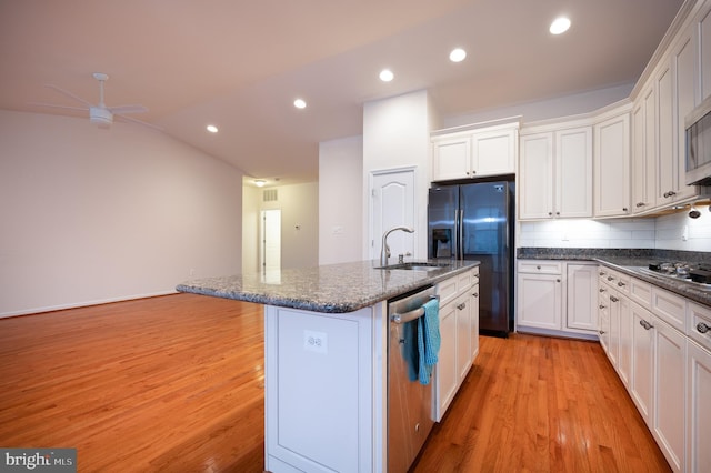kitchen with white cabinets, appliances with stainless steel finishes, ceiling fan, and light wood-style floors