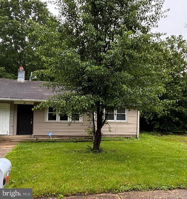 217 Kinsley Rd, Pemberton, NJ 08068 - view of front of property with a front lawn and a chimney