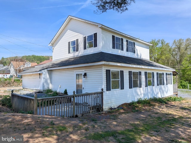 view of front facade featuring a wooden deck