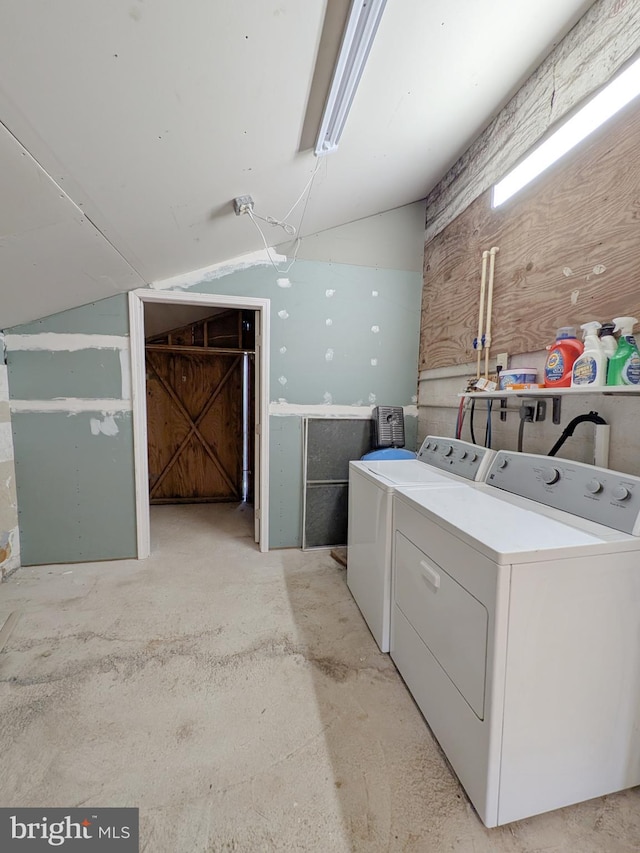 laundry room featuring separate washer and dryer and laundry area