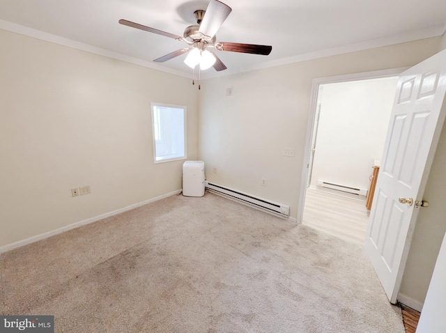 carpeted empty room featuring a baseboard heating unit, ceiling fan, baseboards, ornamental molding, and baseboard heating