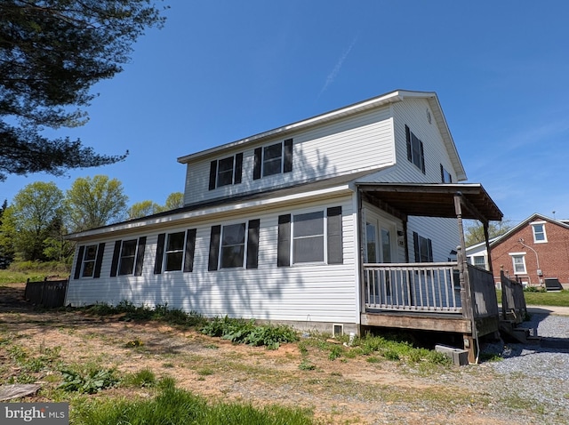 view of front of property with a wooden deck and crawl space