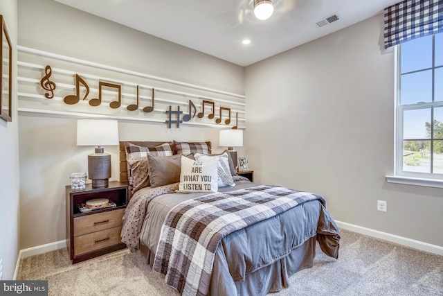 bedroom featuring visible vents, baseboards, and carpet floors